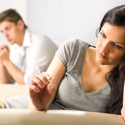 woman looking at wedding ring