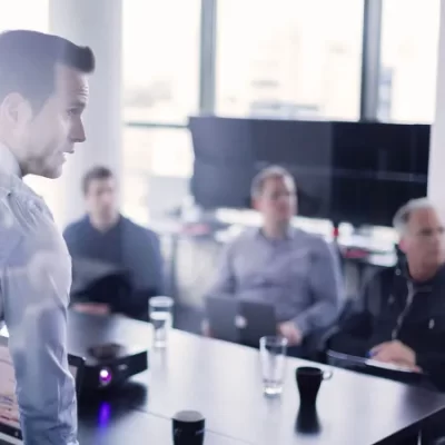 man speaking to others